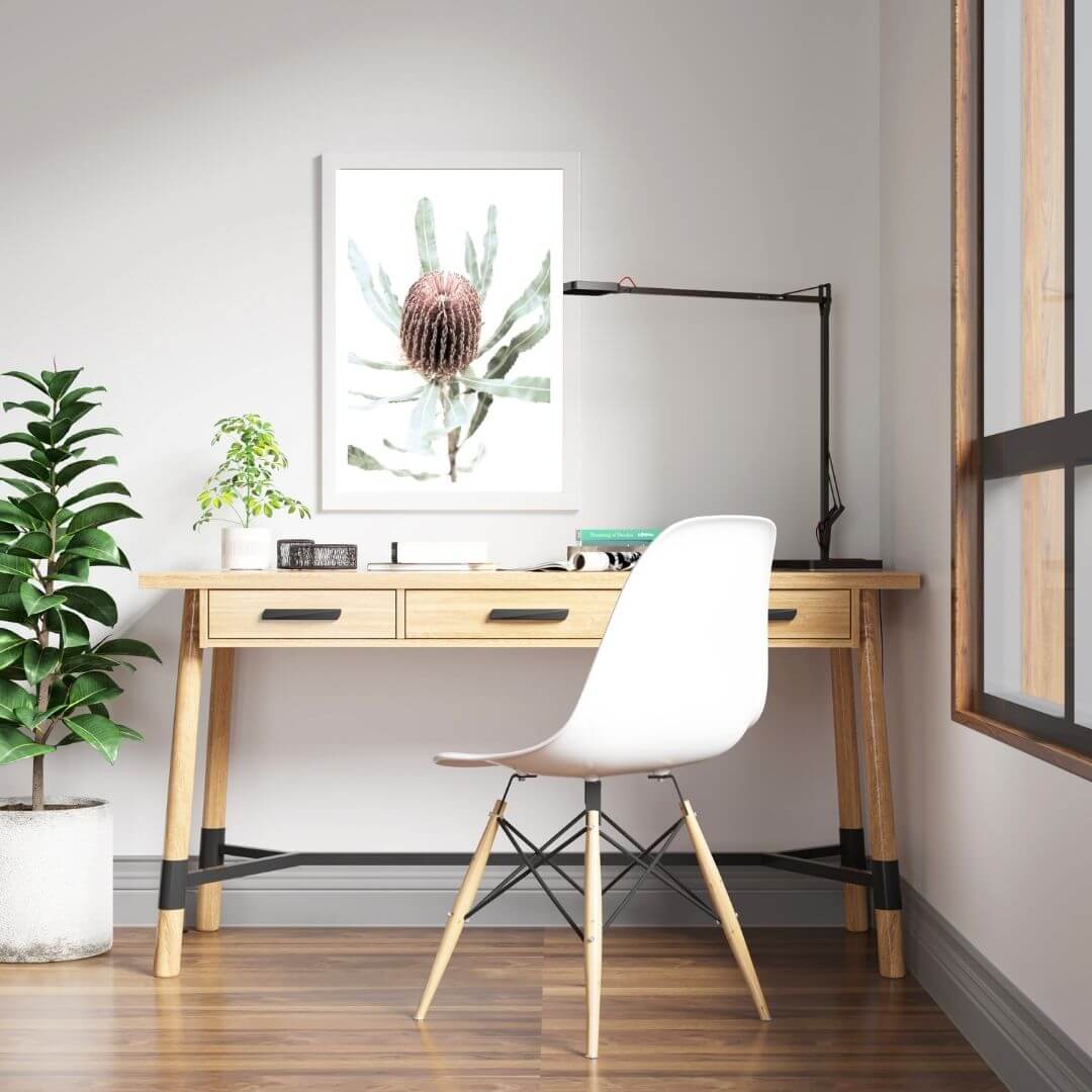 The wall art print of an Australian Native Banksia Floral B with a white frame or unframed above a kids room study desk.