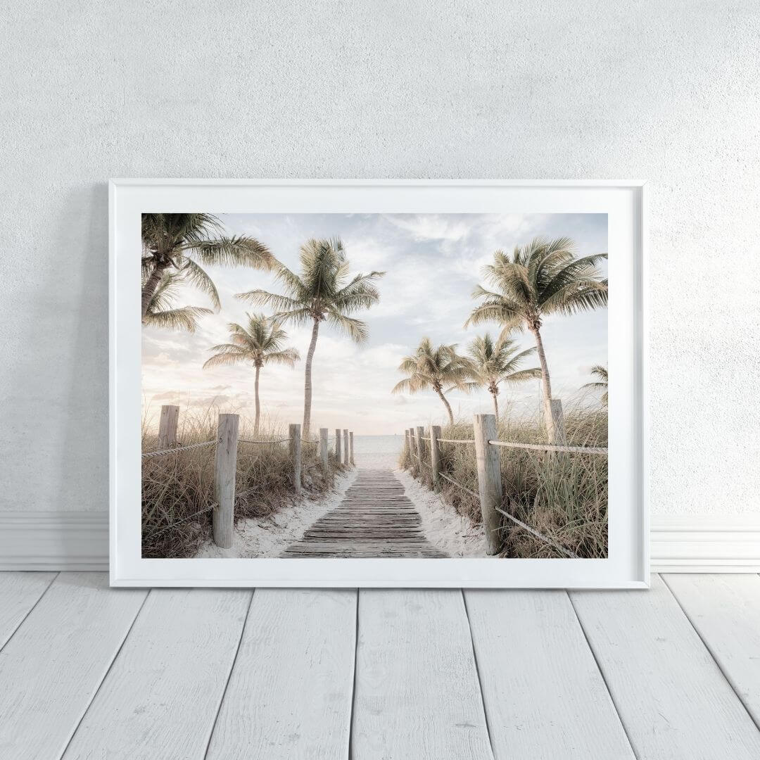 A wall art photo print of a pathway to a beach on the keys florida with palm trees with a white frame or unframed to decorate an empty wall