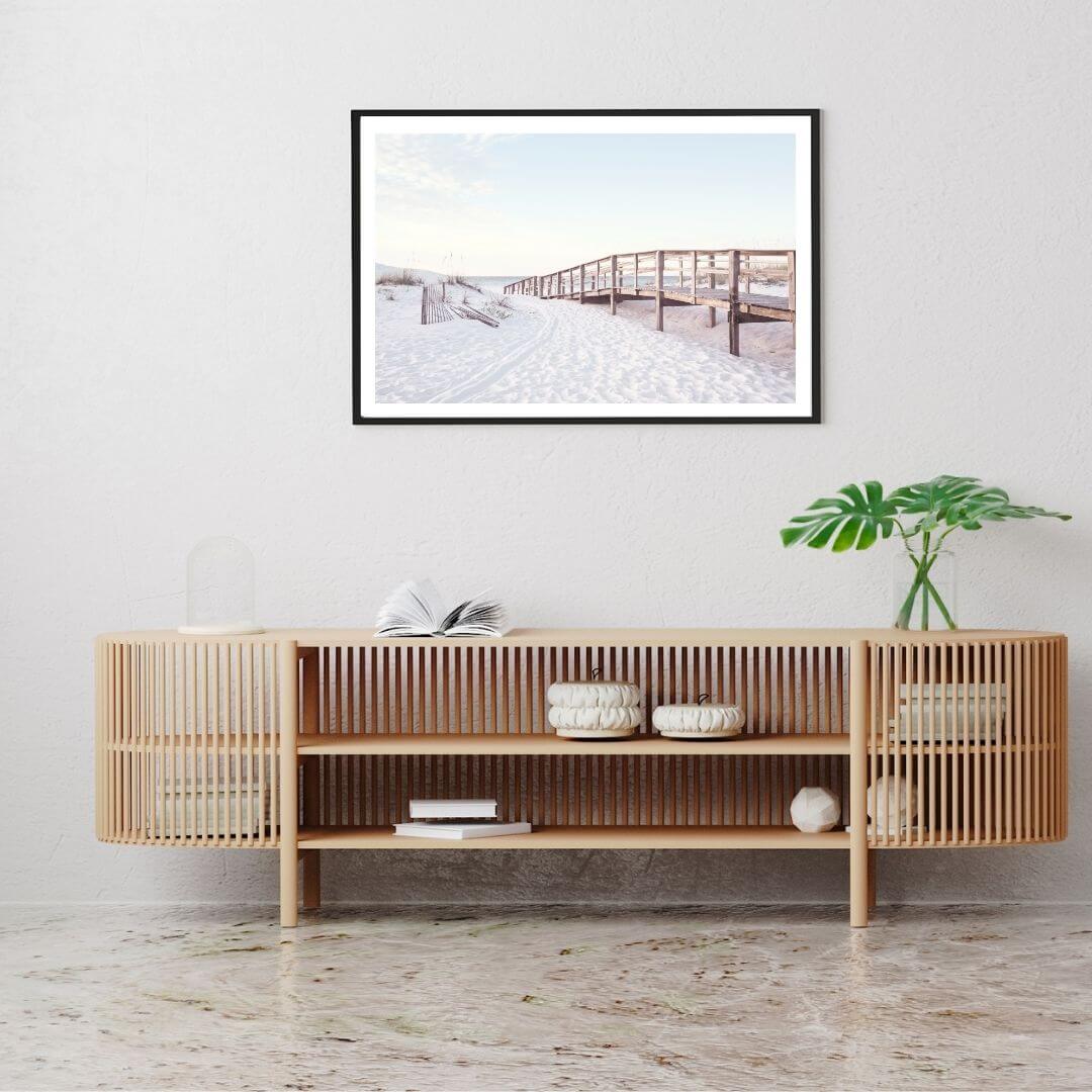 A wall art photo print of a beachside boardwalk with a black frame or unframed to decorate a wall above your console table