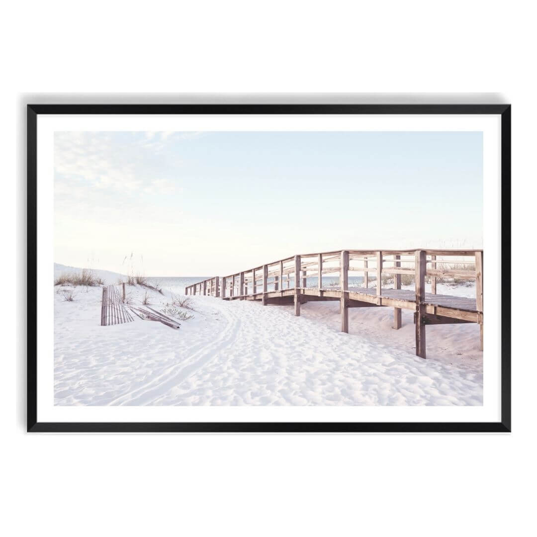 A wall art photo print of a beachside boardwalk with a black frame, white border by Beautiful Home Decor