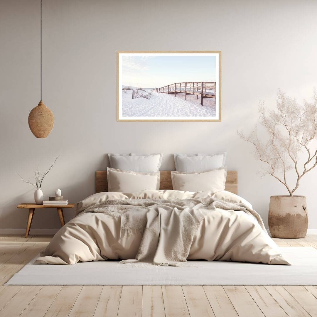 A wall art photo print of a beachside boardwalk with a timber frame to style a coastal Australian bedroom