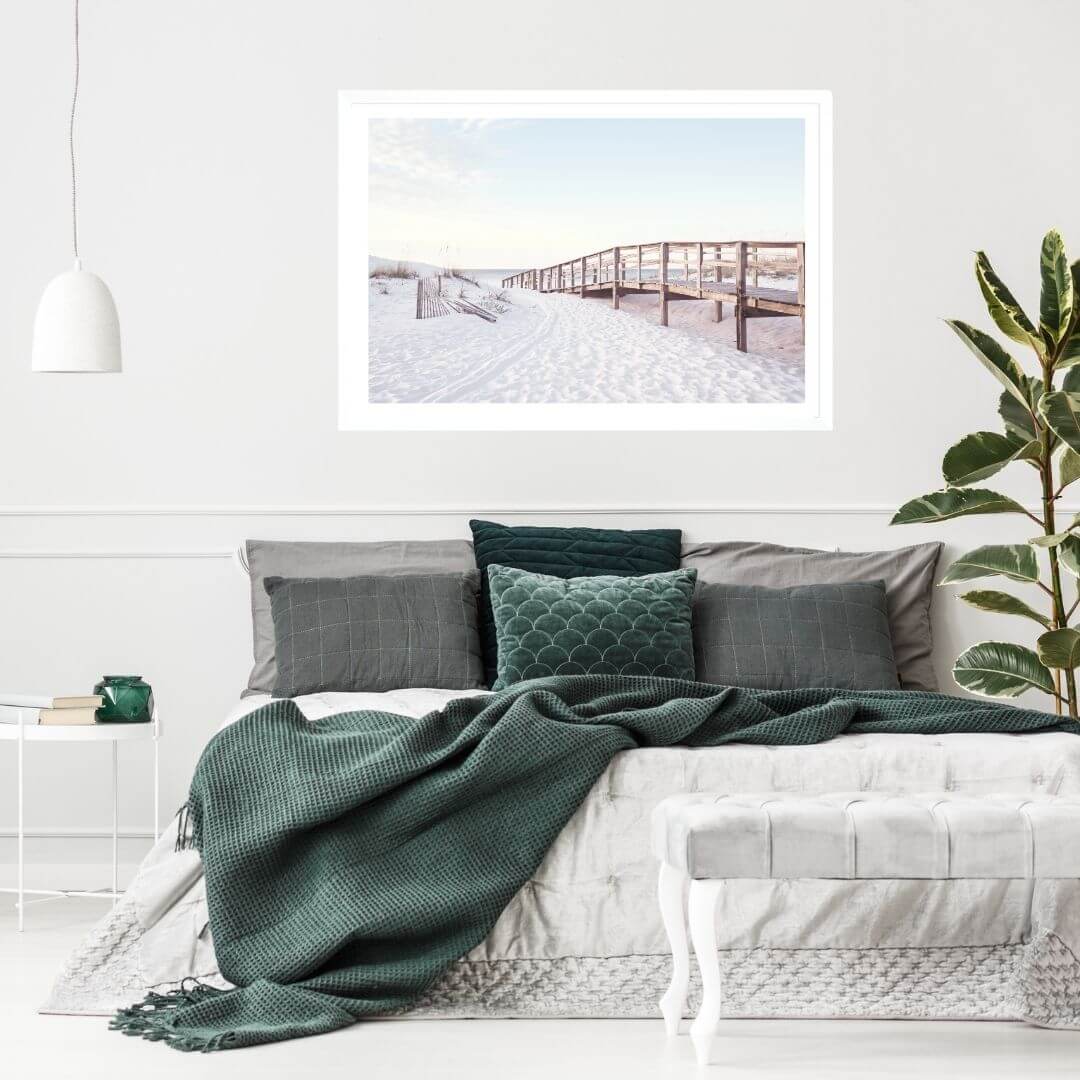 A wall art photo print of a beachside boardwalk with a white frame for the bedroom wall with free shipping