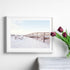 A wall art photo print of a beachside boardwalk with a white frame or unframed to style shelves and empty walls