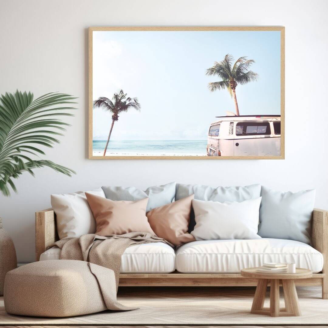A wall art photo print of a blue beachside kombi van with a timber frame to style a wall in living room