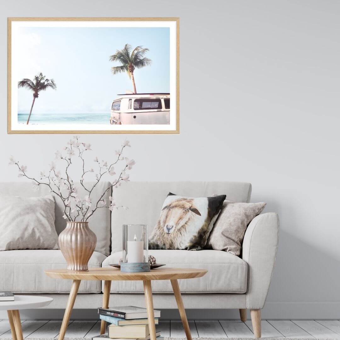 A wall art photo print of a blue beachside kombi van with a timber frame or unframed to decorate walls in living room