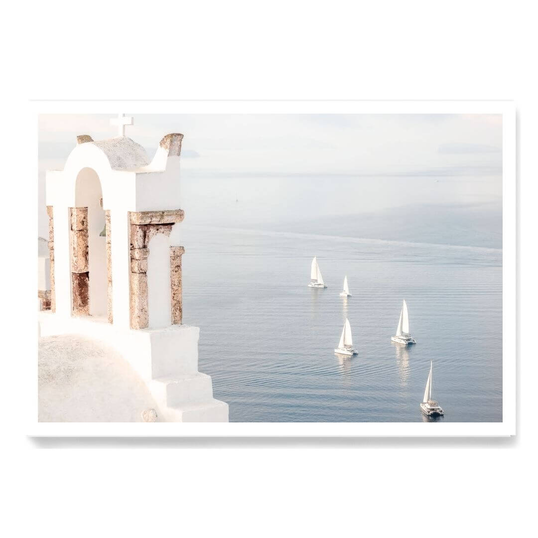 A coastal wall art photo print of Boats sailing on the sea in Santorini Greece  unframed with a white border by Beautiful Home Decor