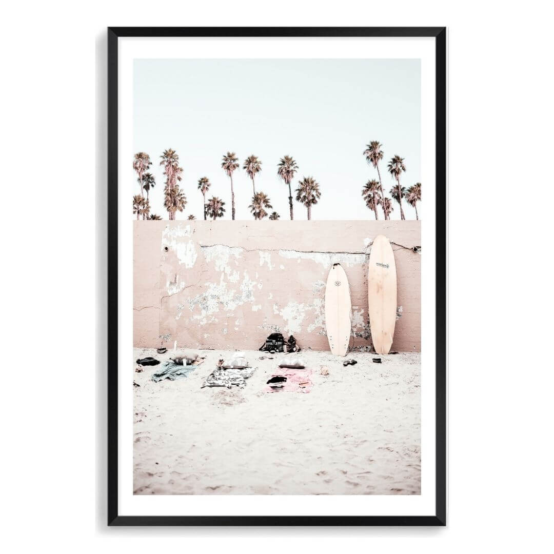 A Coastal Surf Beach Wall Art Print with surfboards with a black frame, white border by Beautiful Home Decor