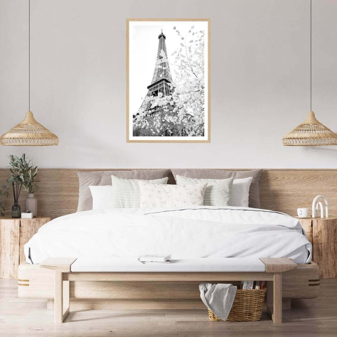 A black and white wall art photo print of the Eiffel Tower in Spring with a timber frame or unframed for the wall above your bedroom bed