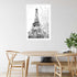 A black and white wall art photo print of the Eiffel Tower in Spring with a white frame or unframed to decorate a wall next to your dining table