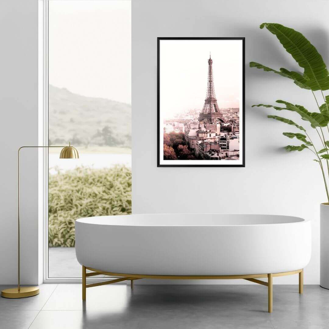 A wall art photo print of the Eiffel Tower in Paris with a black frame, white border on a bathroom wall