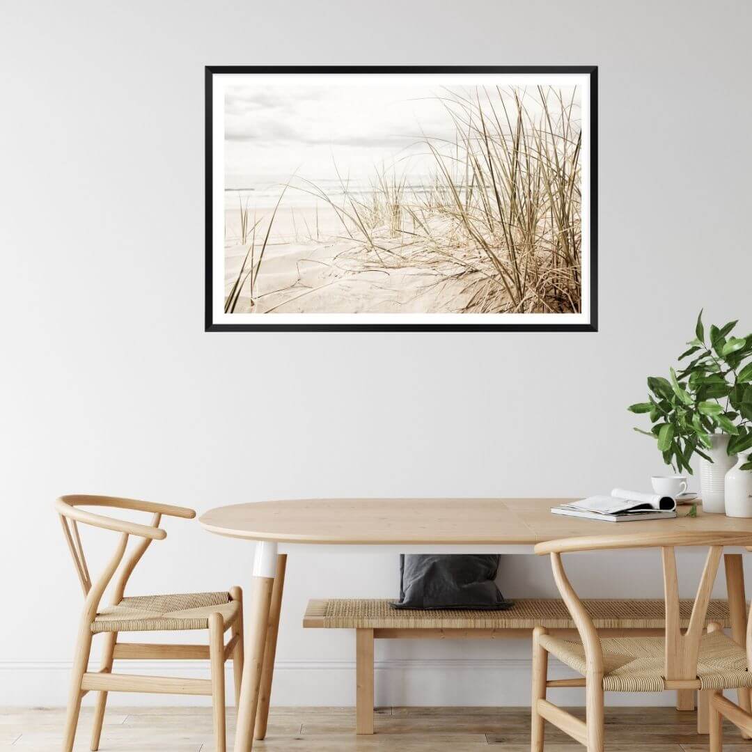 A wall art photo print of a grassy beach shore with a black frame or unframed to style your dining living room