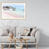 A wall art photo print of a pink beach in Greece with a timber frame or unframed for your coastal living room behind sofa