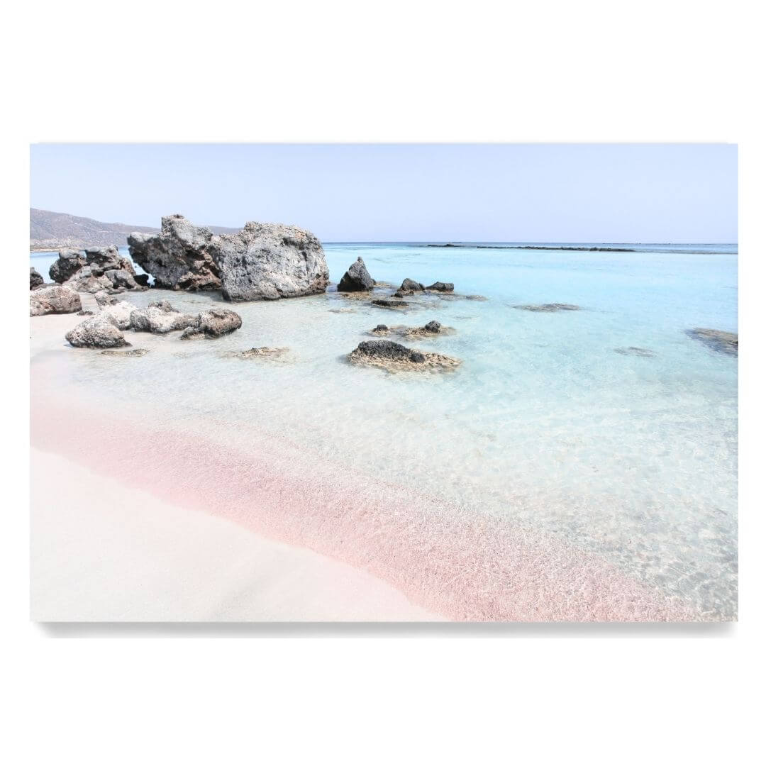 A wall art photo print of a pink beach in Greece unframed, printed edge to edge without a white border