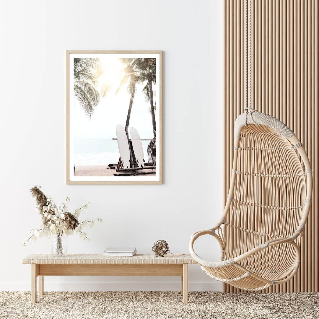 An artwork of a surfer beach in Hawaii with two white surf boards under the palm trees available in an art print.