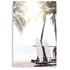 A photo wall art print of two white surf boards under the palm trees on a surfer beach in Hawaii unframed.