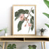 A wall art photo print of native gum eucalyptus flower a with a timber frame to decorate your console table