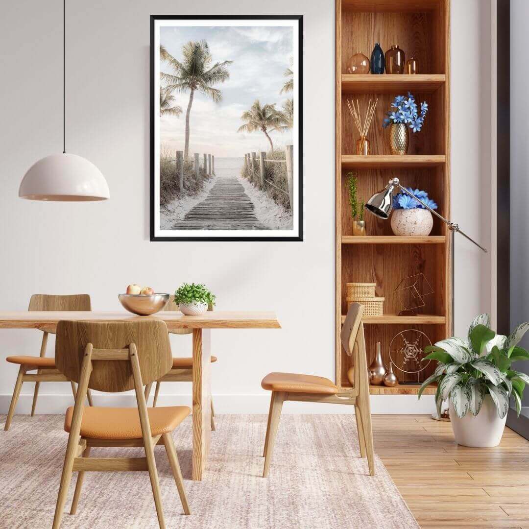 A coastal wall art photo print of a pathway to a beach on the Keys Florida with a black frame, white border in dining room