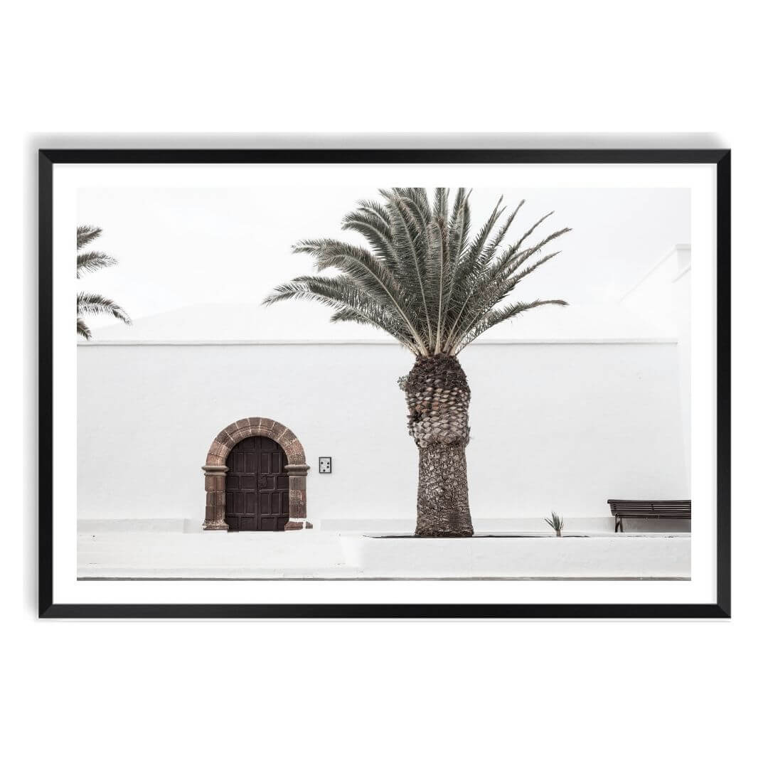 A White Spanish Church Wall Art Print with a Palm Tree  with a black frame, white border by Beautiful Home Decor