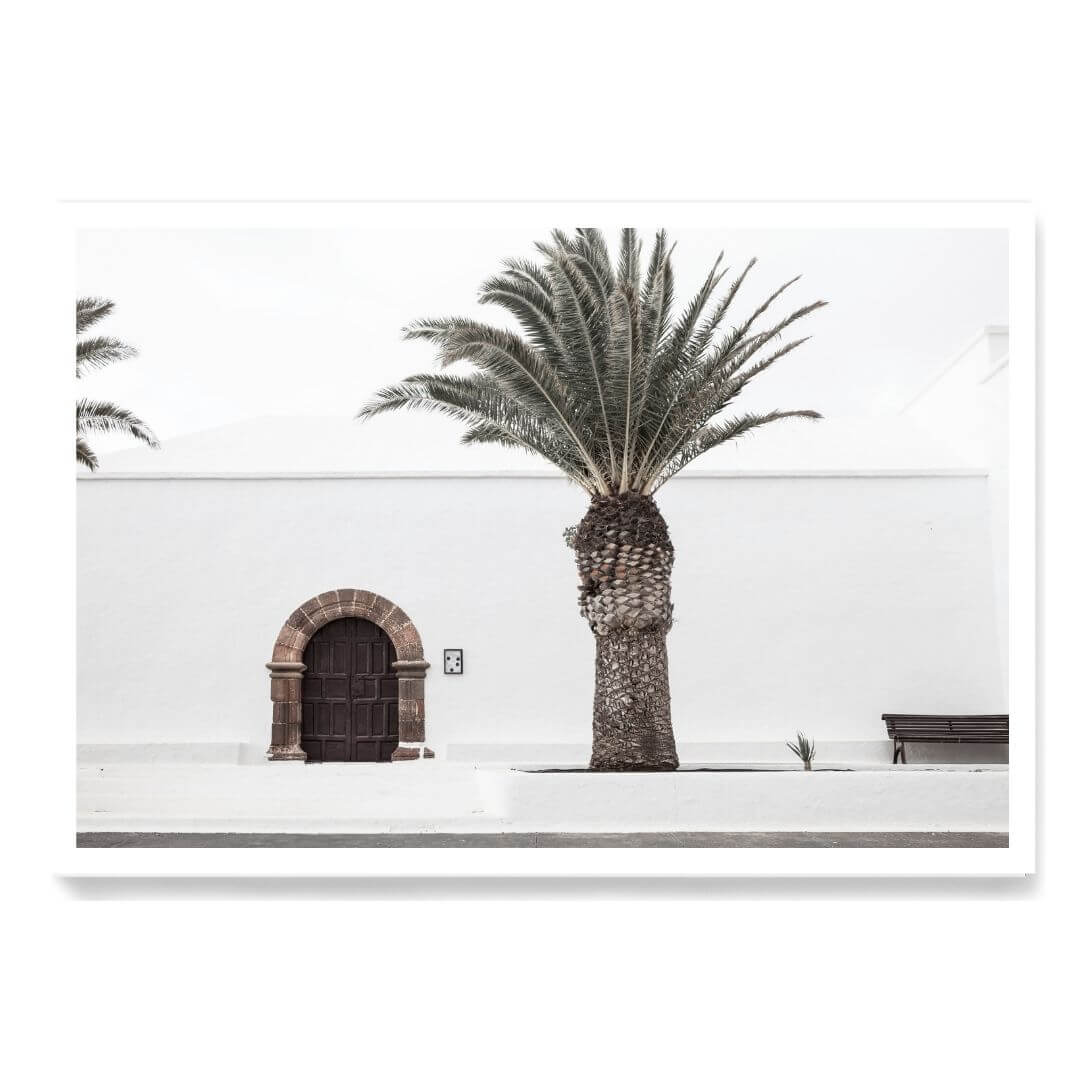 A wall art photo print of a white Spanish Church with a Palm Tree  unframed with a white border by Beautiful Home Decor