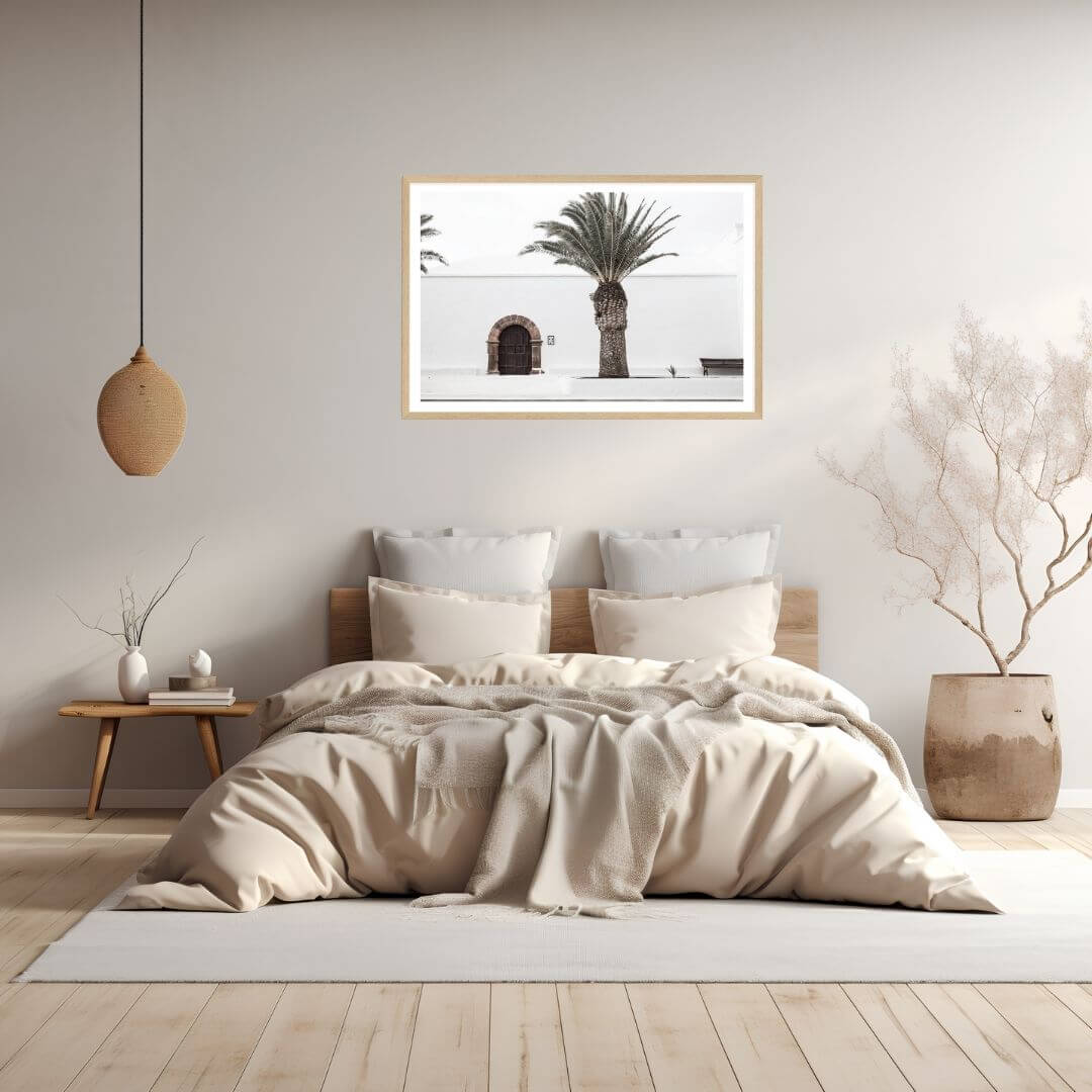 A White Spanish Church Wall Art Print with a Palm Tree  with a timber frame to style a coastal Australian bedroom