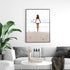 A wall art photo print of the girl with the surfboard with a black frame or unframed to decorate a wall in your living room