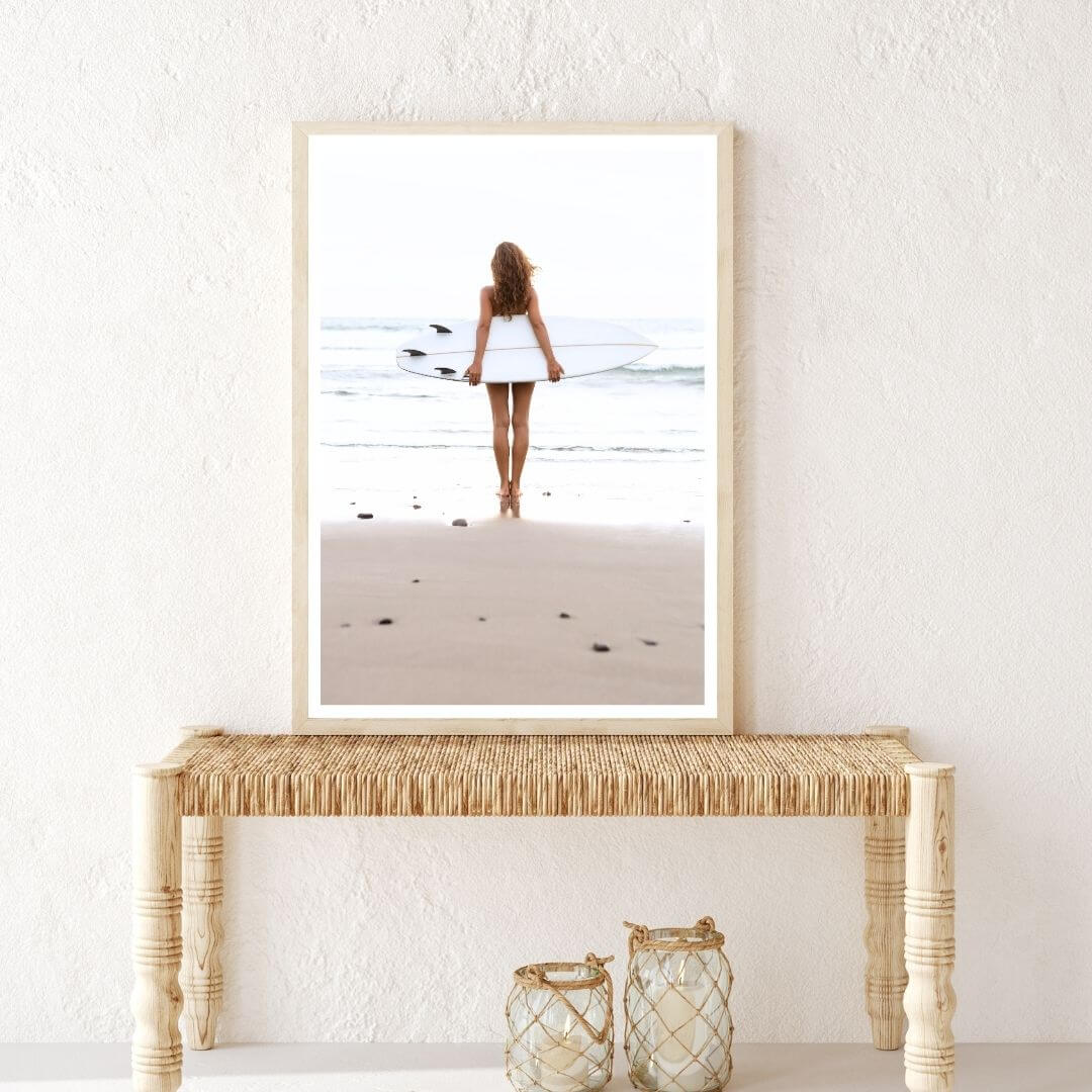 A wall art photo print of the girl with the surfboard with a timber frame in hallway shop online at Beautiful Home Decor with free shipping