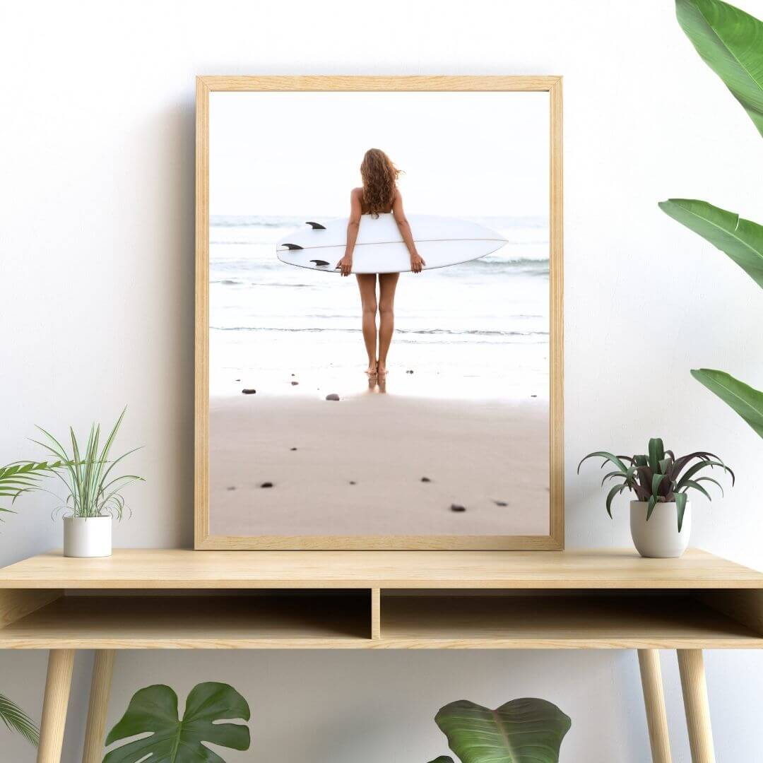 A wall art photo print of the girl with the surfboard with a timber frame or unframed to decorate your console table