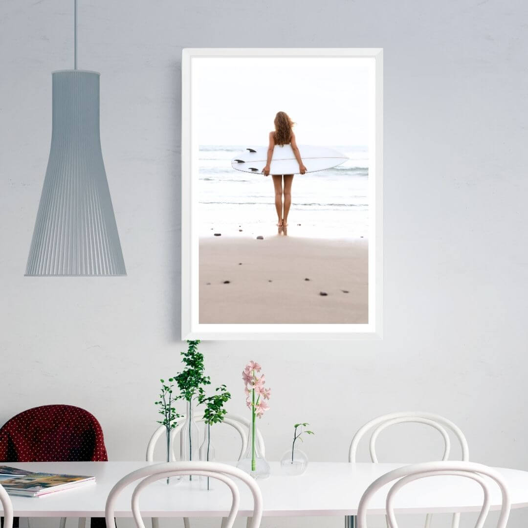 A wall art photo print of the girl with the surfboard with a white frame or unframed to style your dining room walls