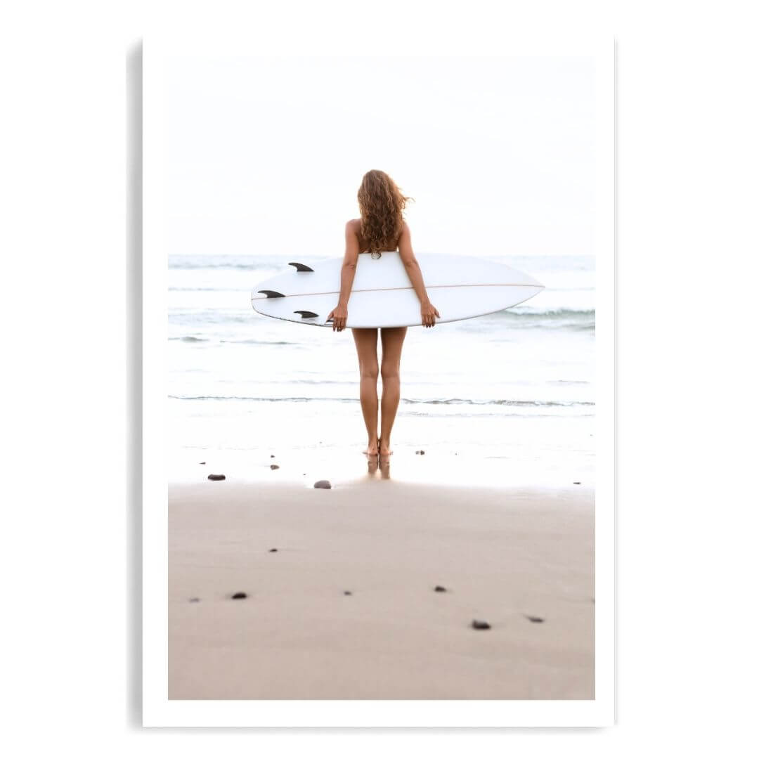 A wall art photo print of the girl with the surfboard unframed with a white border by Beautiful HomeDecor