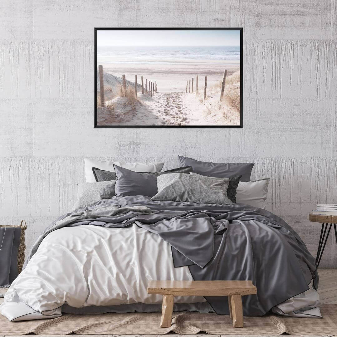 A wall art photo print of a walk on the beach with a black frame or unframed for the wall above your bedroom bed