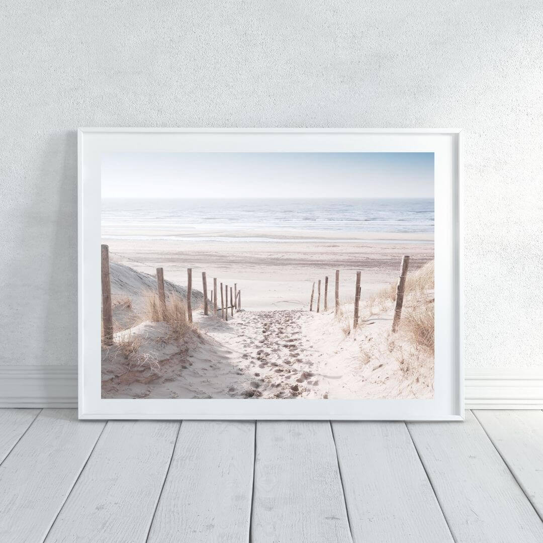 A wall art photo print of a walk on the beach with a white frame or unframed to decorate an empty wall