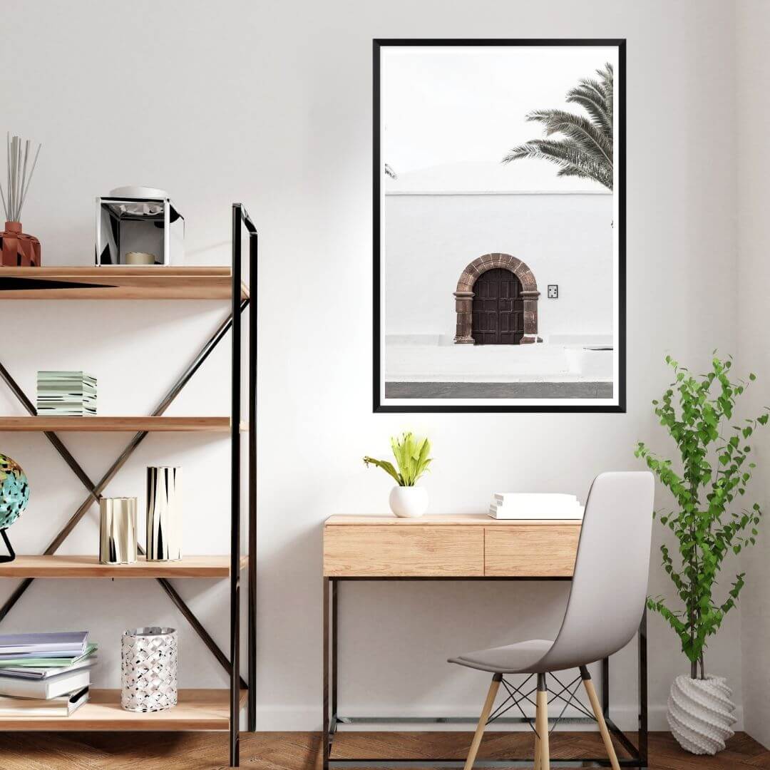 A white Spanish church and door Wall Art Print with a black frame, white border on kids bedroom wall