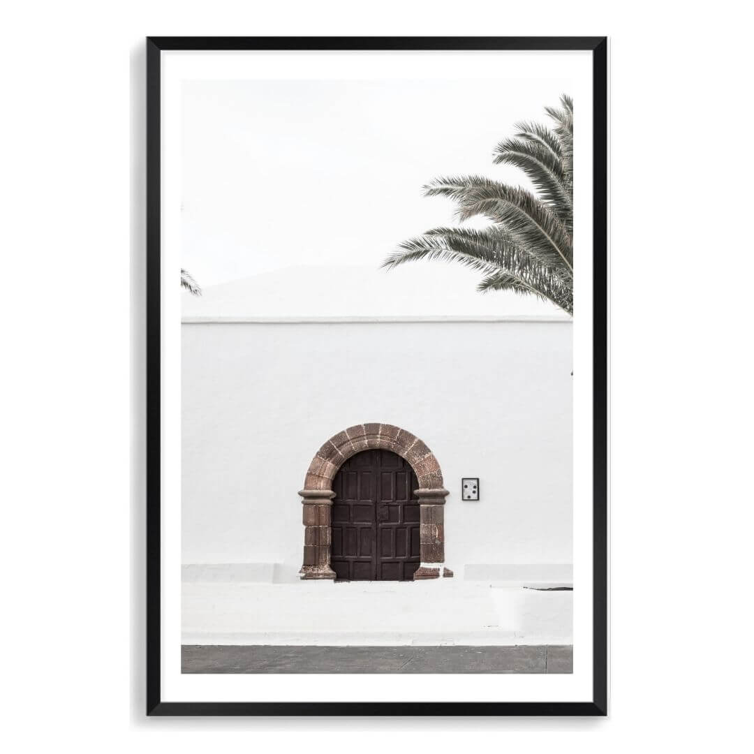 A white Spanish church and door Wall Art  Photo Print with a black frame, white border by Beautiful Home Decor