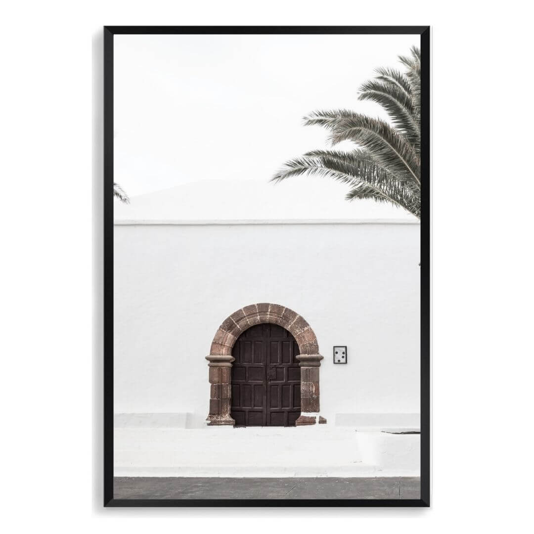 A white Spanish church and door Wall Art Print with a black frame, no white border at Beautiful Home Decor