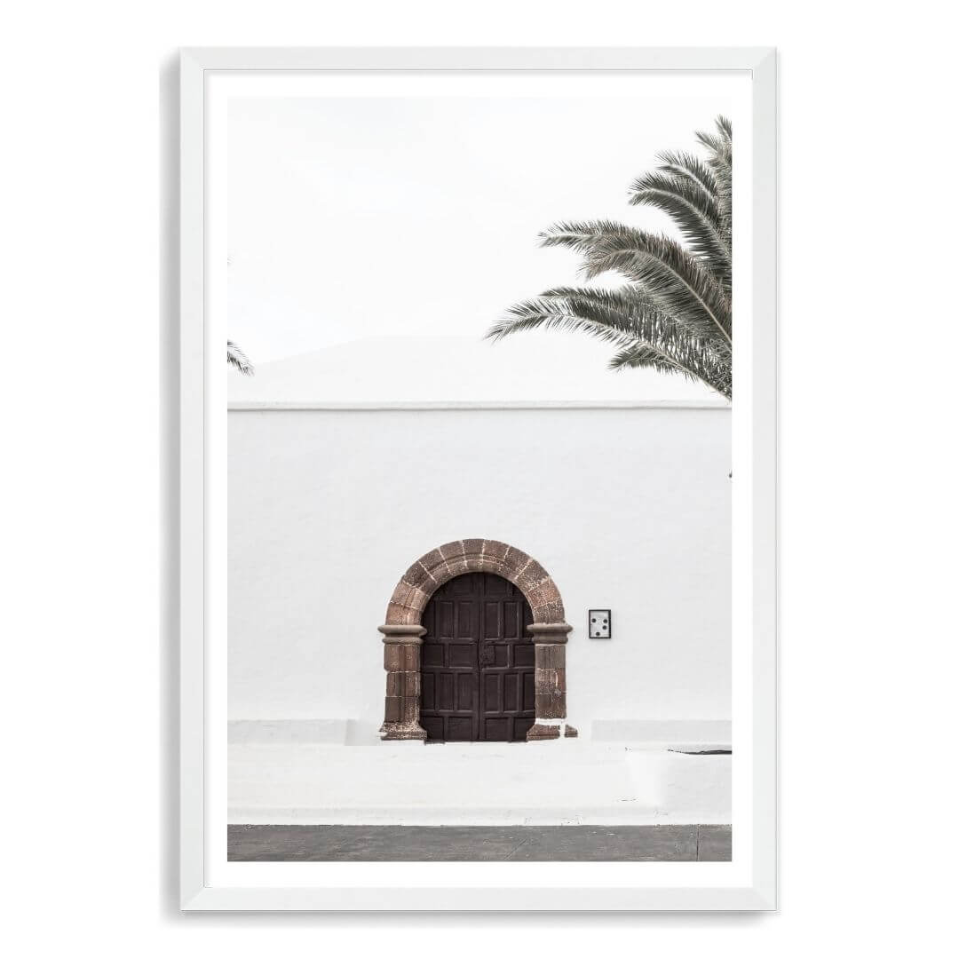 A white Spanish church and door Wall Art Photo Print with a white frame, white border by Beautiful Home Decor